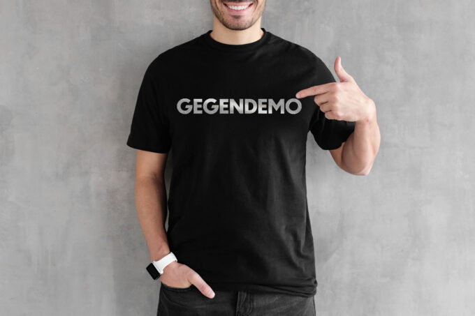 "Gegendemo" T-Shirt - Reflektionsfarbe/schwarz (Unisex/Organic/FairTrade/ÖkoTex)